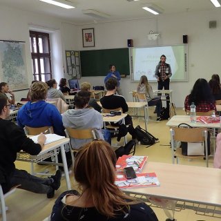 Dawid a Gosia giving a presentation about volunteering in SŠ Horažďovice and Gymnázium Sušice.