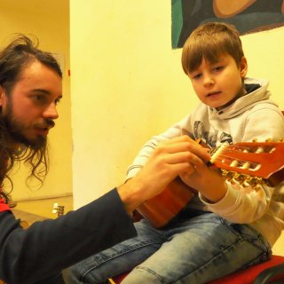 A teacher - leisure time activity for kids - guitar playing. I could pass on my skills and knowledge.